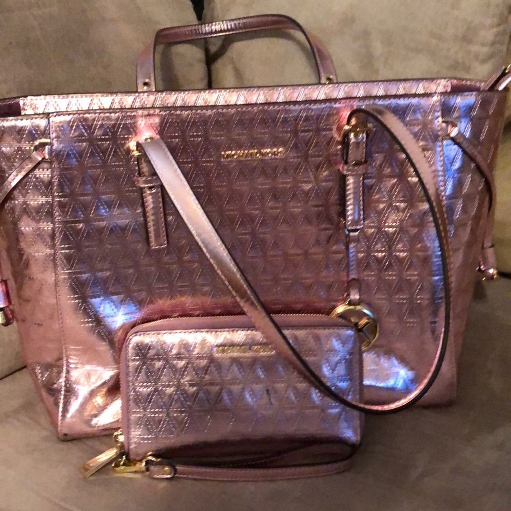 Michael Kors rose gold beautiful handbag.